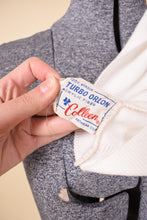 Load image into Gallery viewer, Logo label of embellished white tank top is shown up close. It reads &quot;Turbo Orlon Acrylic Fiber by Colleen Knitwear.&quot;
