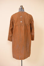 Load image into Gallery viewer, Late 1960s Orange Blue Green Stripe Silver Button Mini Dress By Marimekko, pictured from the back.