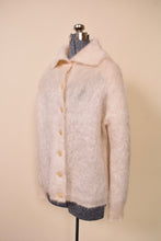 Load image into Gallery viewer, Cream Mohair Fuzzy Knit Cardigan By Jaeger. Pictured from side.