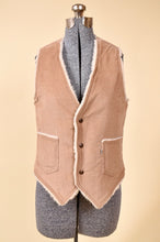 Load image into Gallery viewer, Tan corduroy Levi&#39;s vest is shown from the front. The vest has sherpa lining.
