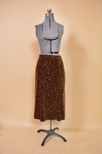 Load image into Gallery viewer, Brown 1970s Velvet Three Piece Set by Miss Dior, S/M. Skirt pictured from front.