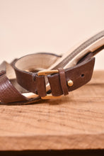 Load image into Gallery viewer, Designer Gucci heels are shown from the side close up. The heels have a brass buckle.