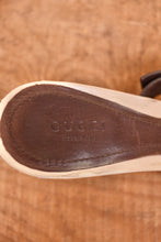 Load image into Gallery viewer, Gucci heels are shown zoomed in. The shoes have the brand on the brown sole of the shoes.
