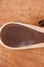 Load image into Gallery viewer, Gucci heels are shown zoomed in. The shoes have the brand on the brown sole of the shoes.