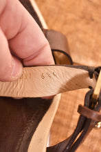 Load image into Gallery viewer, Zoomed in picture of the strap of the y2k heels. The shoes are a size women's 6.5.