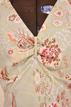 Load image into Gallery viewer, Vintage dress is shown close up. The dress is cinched at the neckline.
