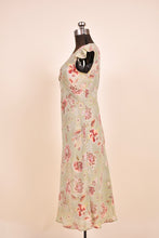 Load image into Gallery viewer, Vintage midi dress by Dress U is shown from the side. The dress has short sleeves.
