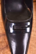 Load image into Gallery viewer, Gucci heels are shown close up. The heels have a large G on the toe.