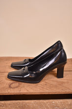 Load image into Gallery viewer, Gucci black heels are shown from the side. The shoes have a square toe.
