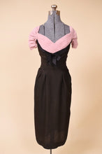 Load image into Gallery viewer, Black and pink dress is shown from the front. The dress is fitted.