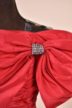 Load image into Gallery viewer, Red 80s ruched off shoulder cocktail dress with bows, closeup of the rhinestone bow detail
