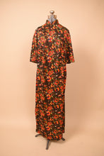 Load image into Gallery viewer, Psychedelic christmas floral maxi dress shown unpinned on the dress form
