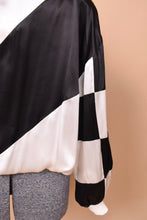 Load image into Gallery viewer, close up of checkered sleeve
