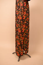 Load image into Gallery viewer, Psychedelic christmas floral maxi dress closeup of the side slit shown
