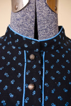 Load image into Gallery viewer, Vintage black cotton midi length prairie dress with blue calico floral print design is shown in close up. This dress has a high collarless neckline.