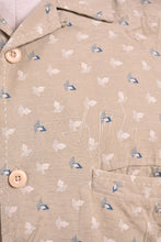Load image into Gallery viewer, Vintage beige silk printed shirt by Nat Nast is shown in close up. This top has a subtle cocktail pattern embossed. 
