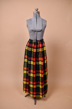 Load image into Gallery viewer, The skirt rests at the mannequin natural waist and is nearly floor length.
