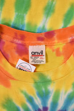 Load image into Gallery viewer, Vintage tie dye multicolor rainbow tee shirt by Anvil is shown in close up. This tee shirt is tagged a size XL.
