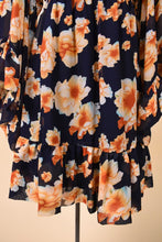 Load image into Gallery viewer, Vintage navy blue mini dress is shown in close up. This dress has a bottom ruffle hem for a flouncy fit.