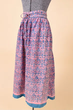 Load image into Gallery viewer, Vintage size XXL pink and blue cotton block print skirt by Anokhi is shown from the side. This maxi length skirt has a geometric block print. 
