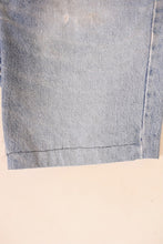Load image into Gallery viewer, Vintage handmade seventies Levis orange tab shorts are shown in close up. 
