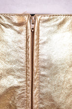 Load image into Gallery viewer, Vintage gold leather nineties Kenar skirt is shown in close up. This skirt has a zipper. 

