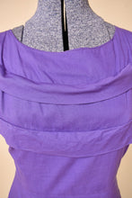 Load image into Gallery viewer, Vintage purple 50's cotton midi dress by Brief Measure is shown in close up. This dress has ruffled details on the neckline.