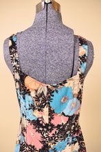 Load image into Gallery viewer, Vintage pastel floral print feminine dress is shown in close up. This ruffled midi dress has blue, pink, tan, and sage green flowers.