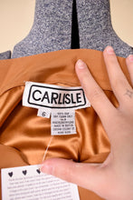 Load image into Gallery viewer, Vintage 1980&#39;s silk blouse by Carlisle is shown in close up. This top was made in Hong Kong. 
