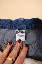 Load image into Gallery viewer, Vintage eighties made in Austria thin denim navy blue jeans are shown in close up. These jeans are by the brand Emmegi. 

