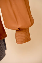 Load image into Gallery viewer, Vintage 80&#39;s copper colored silk blouse is shown in close up. This blouse has puff sleeves. 
