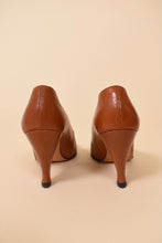Load image into Gallery viewer, Vintage soft brown leather heel pumps are shown from the back.