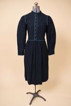 Load image into Gallery viewer, Vintage 1970s Lanz floral cotton prairie midi dress is shown in close up. This dress has long puff sleeves.