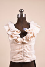 Load image into Gallery viewer, Vintage ivory new with tags sleeveless ruffled terry cloth top is shown from the front. This ruched terry cloth top has a deep v neckline. 
