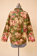 Load image into Gallery viewer, Vintage olive green cotton chore coat is shown from the back. 
