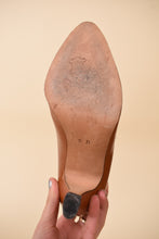 Load image into Gallery viewer, Vintage Escada caramel brown leather pumps are shown from the bottom.