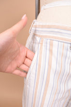 Load image into Gallery viewer, Vintage early 2000's striped cropped pants by Theory are shown in close up. These pants have pockets at the hips.