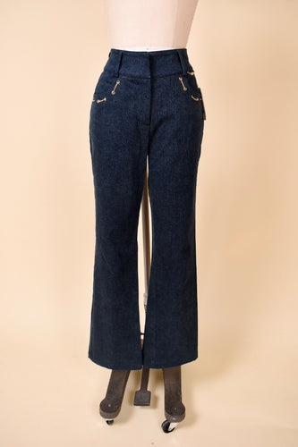 Vintage Y2K denim navy jeans by St. John are shown from the front. This boot cut jeans have a flare leg. 