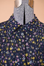 Load image into Gallery viewer, Zadig and Voltaire star patterned babydoll dress is shown in close up. This dress has buttons at the bust.
