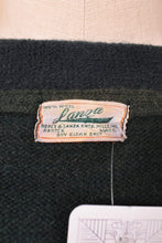 Load image into Gallery viewer, Vintage 40&#39;s antique green wool knit collegiate letterman sweater is shown in close up. This University of Vermont cardigan sweater is by the brand Lanza. 
