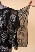 Load image into Gallery viewer, Vintage White House Black Market sheer beaded flowy handkerchief top is shown from the front. This sexy flowy top has white beaded roses on the front. 
