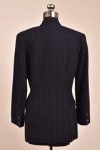 Load image into Gallery viewer, Vintage black pinstripe blazer by Charles Chang Lima is shown from the back. 
