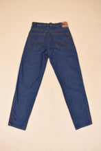 Load image into Gallery viewer, Vintage 80s medium wash blue denim boyfriend style jeans are shown from the back. These classic jeans have two back pockets. 
