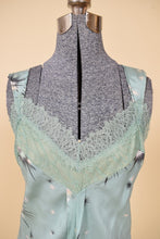 Load image into Gallery viewer, Vintage green silk Y2K lacy tank is shown in close up. 
