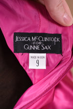 Load image into Gallery viewer, Vintage dress tags are shown close up. The dress was made in the USA.
