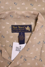 Load image into Gallery viewer, Vintage light tan silk button down top is shown in close up. This shirt has a tag that reads Nat Nast Luxury Originals.
