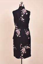 Load image into Gallery viewer, Vintage black and pink floral print dress is shown from the back.