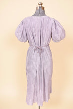 Load image into Gallery viewer, Vintage Pierre Labiche eighties pastel purple micropleat grecian dress is shown from the back. This purple midi length dress has puff sleeves.