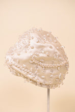 Load image into Gallery viewer, Vintage fifties designer Christian Dior turban is shown from the side. This bejeweled beaded turban has pearl and crystal beads. 

