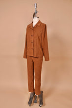 Load image into Gallery viewer, Vintage 90s brown suede two piece pants and blazer set is shown from the side. This cowgirl style set has a faux suede blazer and pants.
